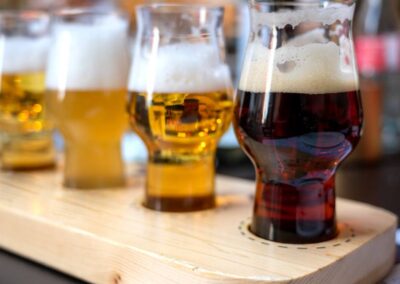 Beer tasters lined on a wooden board